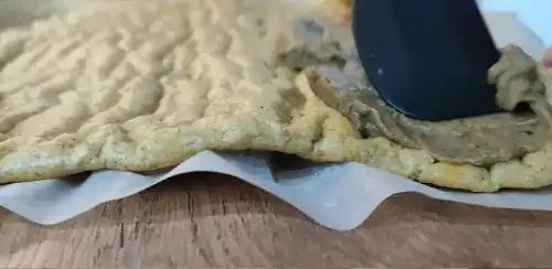Spread a layer of mushroom pate evenly