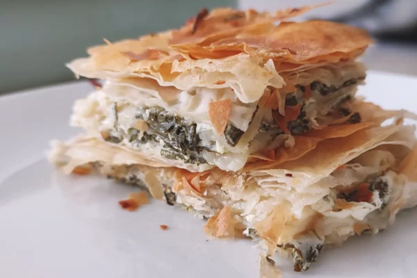 Nettle and Cheese Pie Squares served on white plate