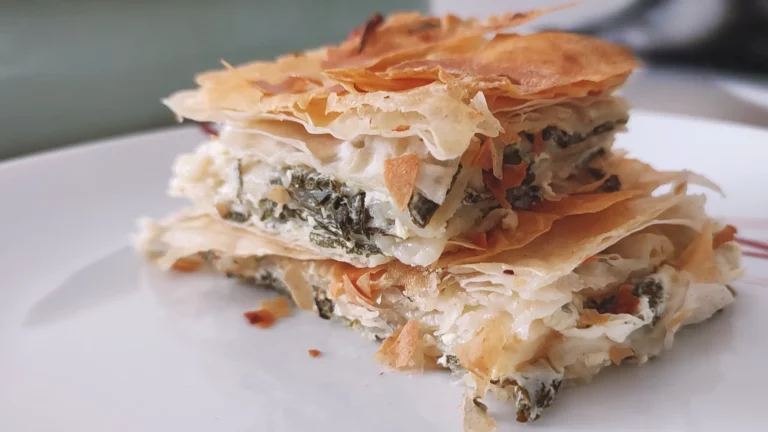 Nettle and Cheese Pie Squares served on white plate