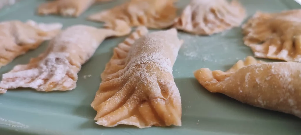 Homemade Ravioli without machine decorated with fork