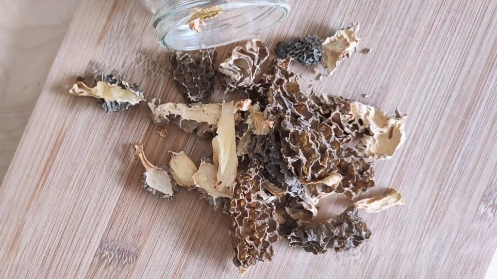 Top view of dried morel mushroomsstored in a jar