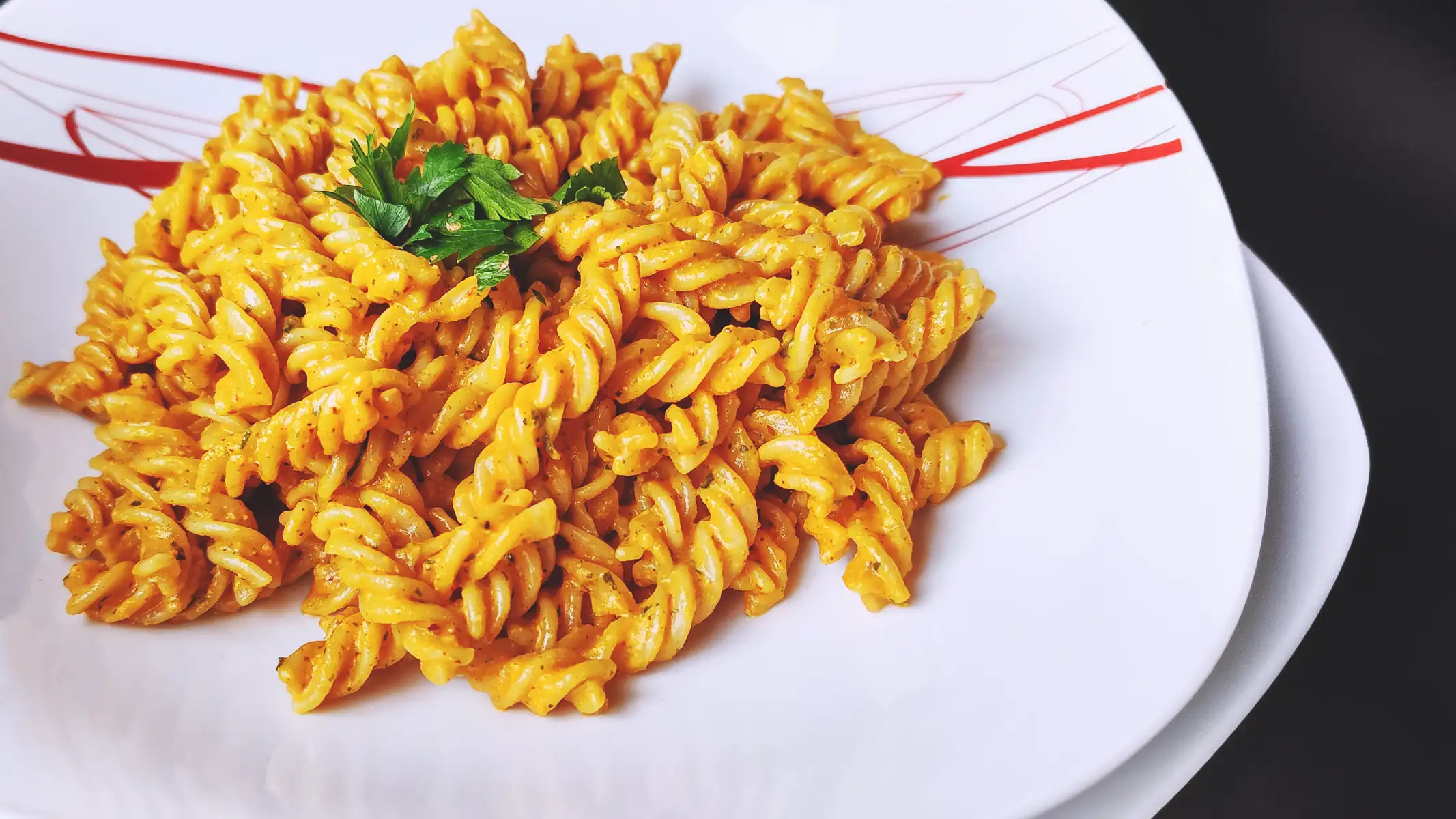 Dried Tomato Pesto Pasta served on a white plate